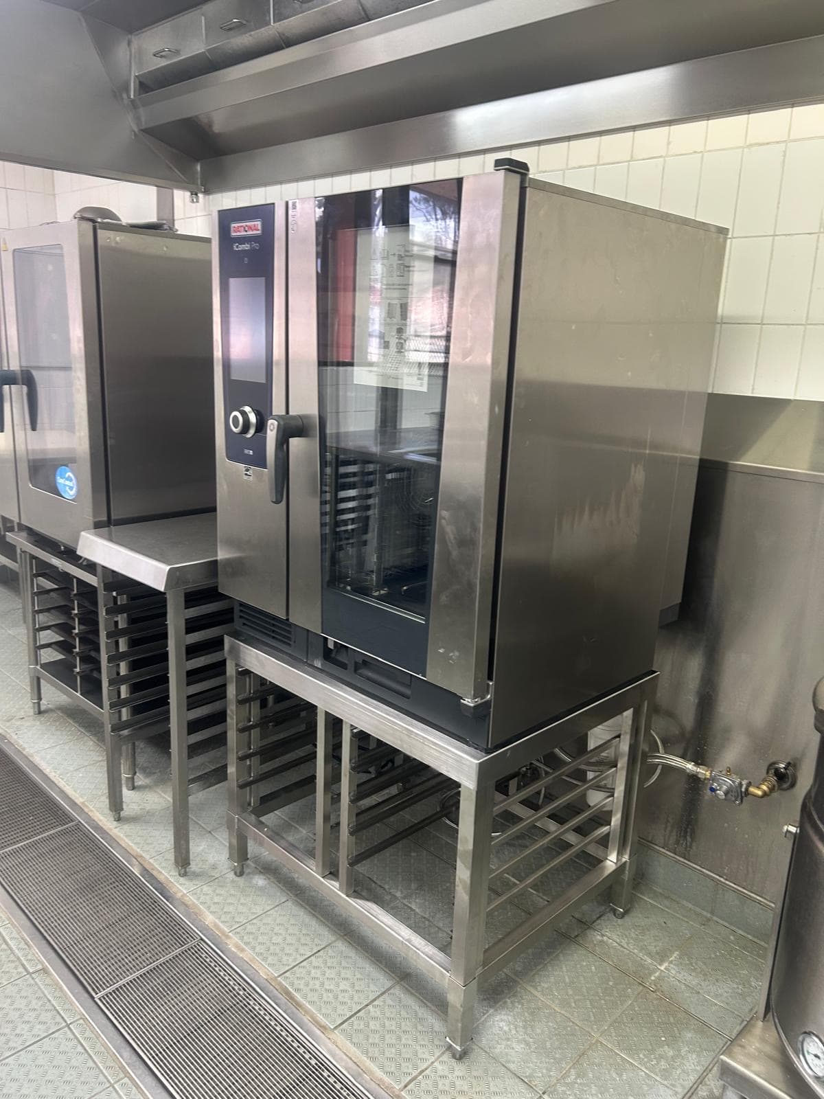 Combi oven installed by TBH Plumbing Solutions on a stainless stand in a commercial kitchen